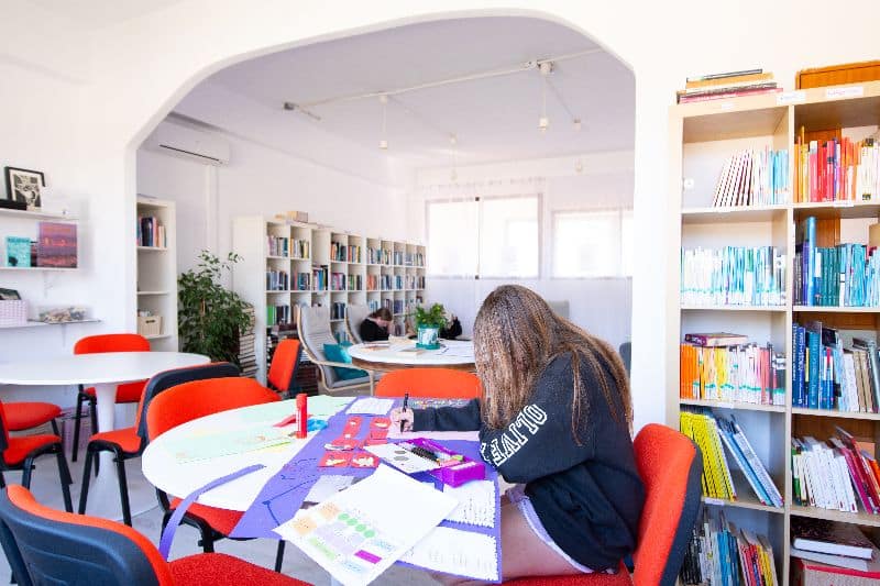 Students working in the Secondary School Library at the Olive Tree