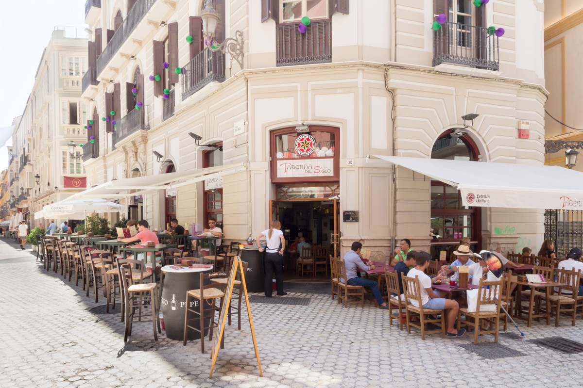 An outdoor cafe in Malaga. Lots of expat sitting and enjoying living in Andalucia