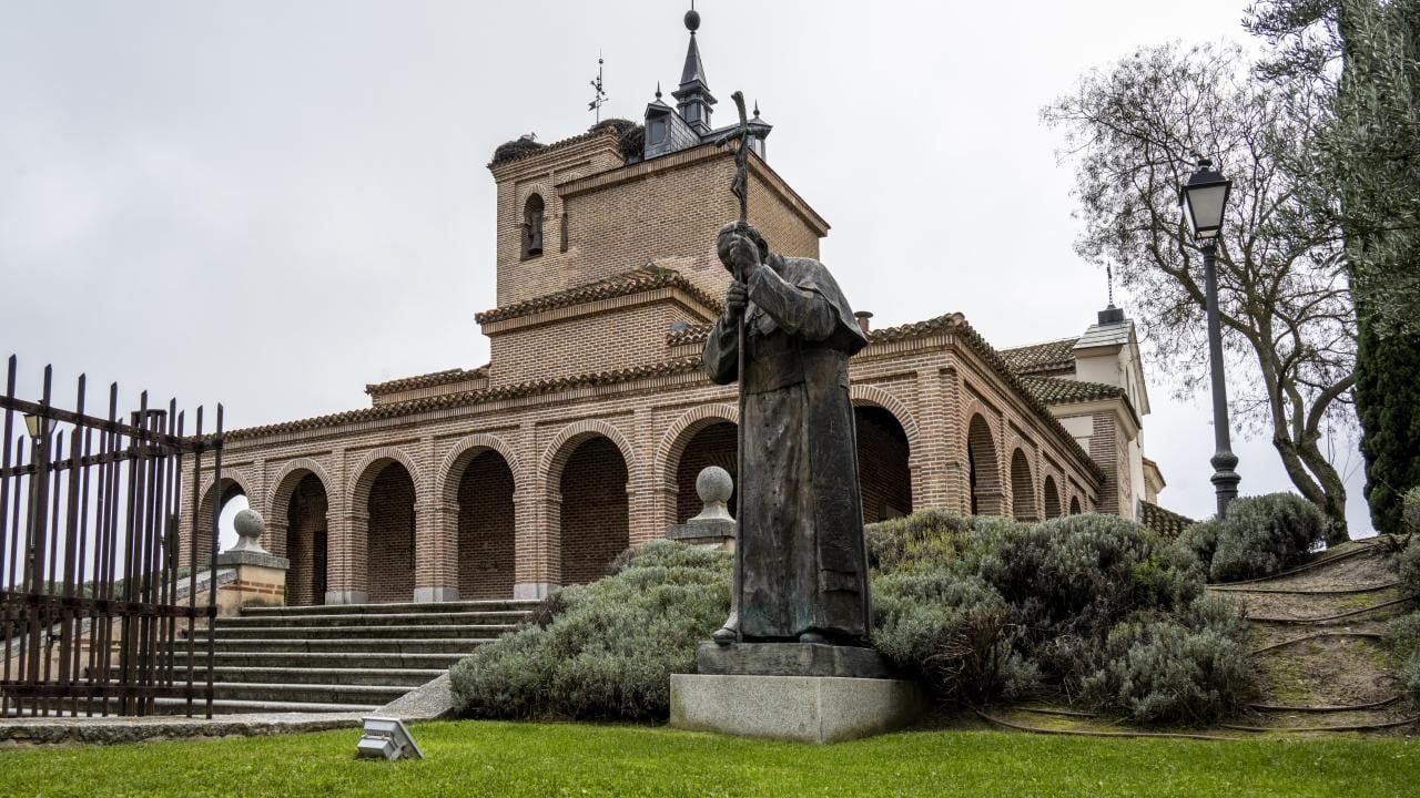Brick hermitage and statue in the historic centre of Boadilla del Monte