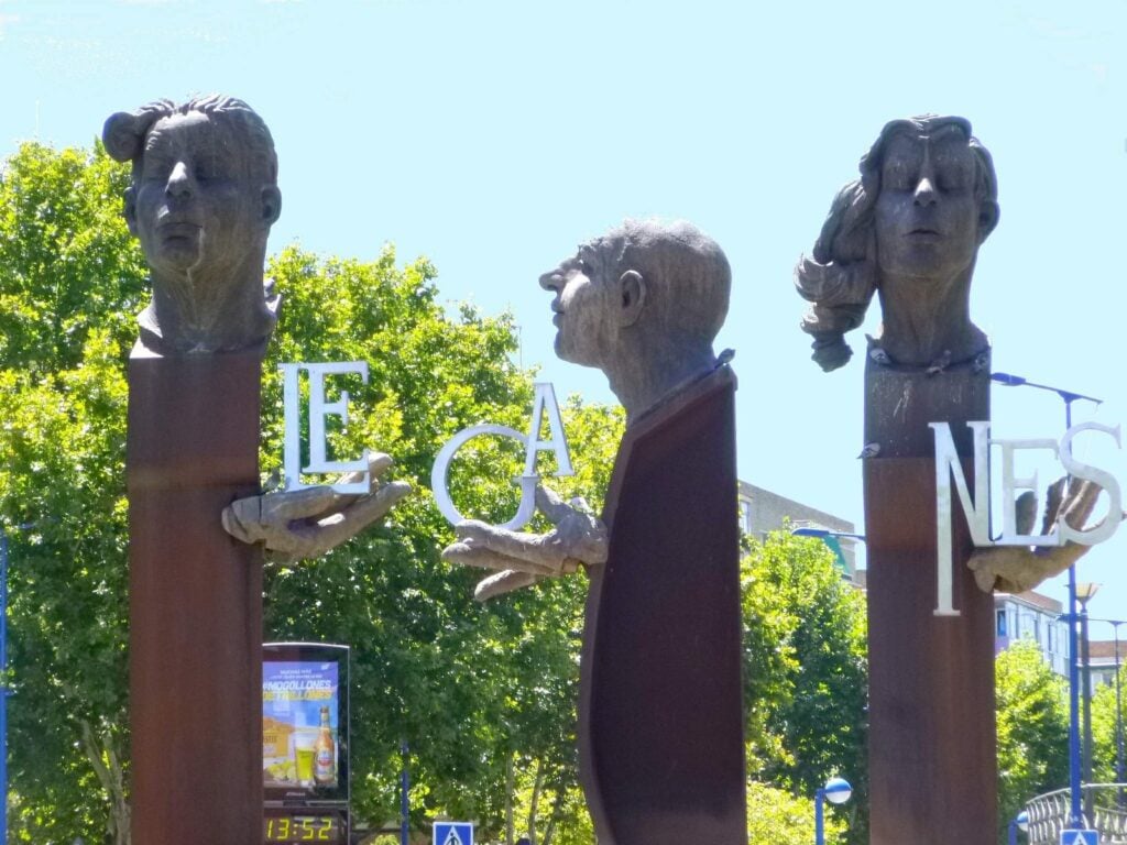 Three large sculpted heads spelling out "Leganés" at the entrance to the southern Madrid municipality