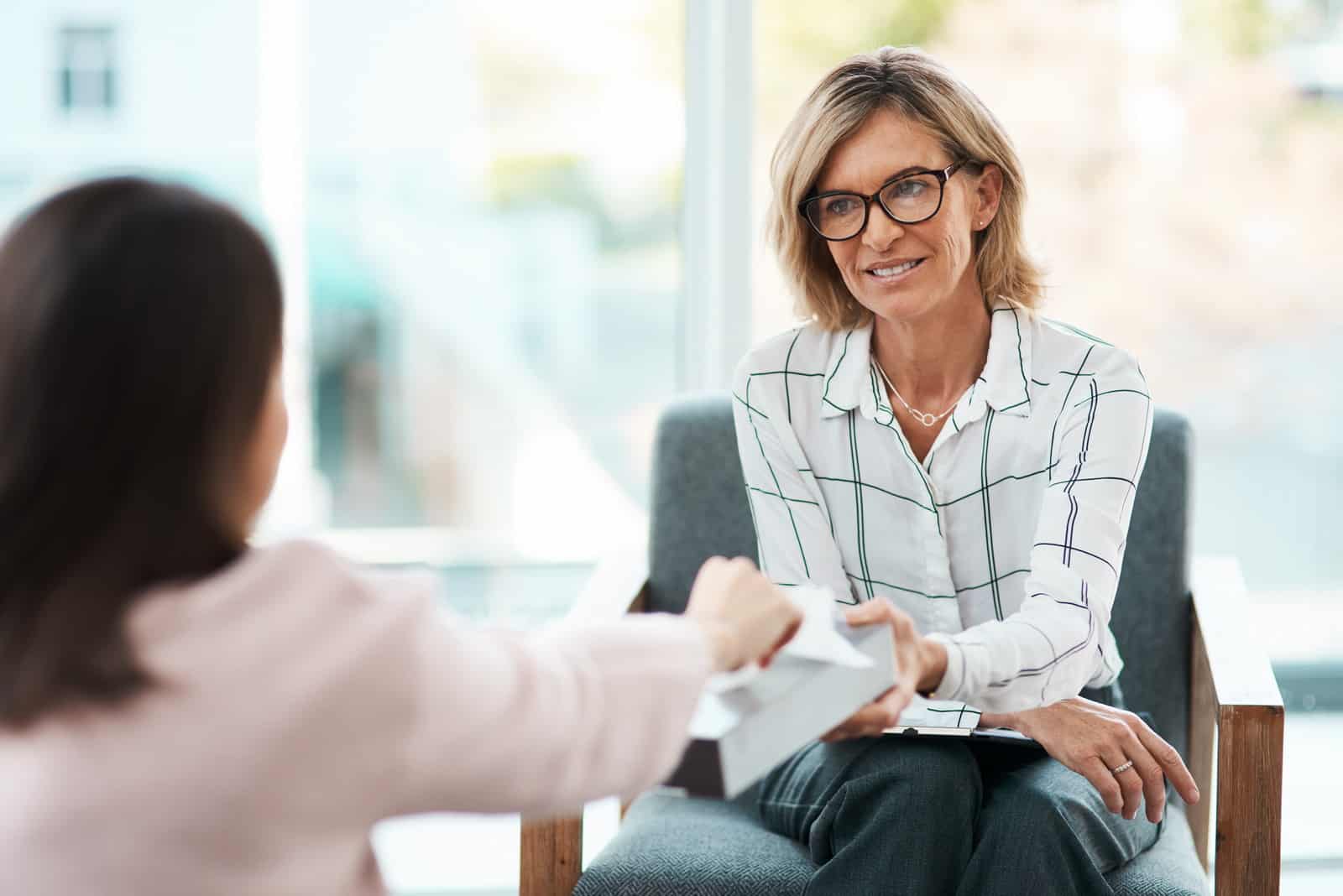 A lady consulting with an immigration lawyer about Spain Visa Types