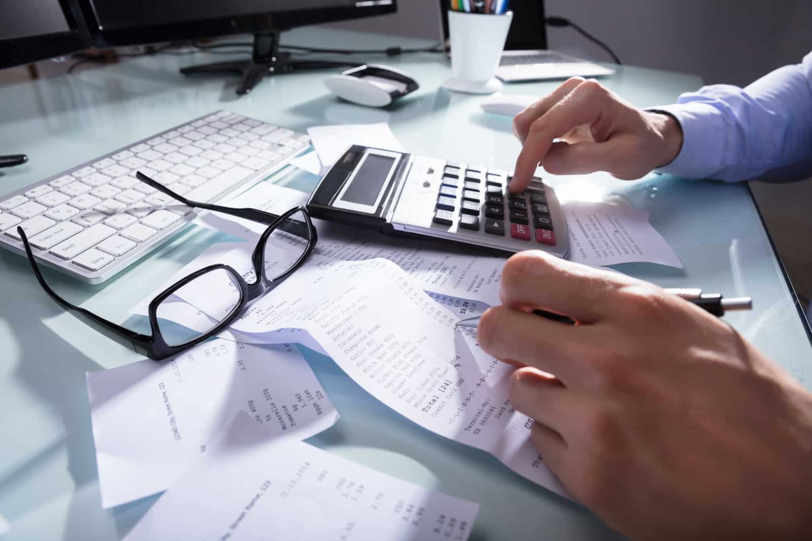 Man calculating his Spain Tax obligations