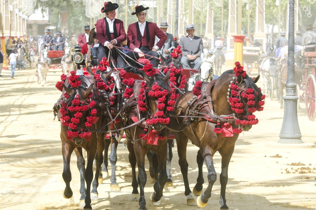 Jerez de La Frontera, Spain: People mounted on a horse and carriage at the Feria