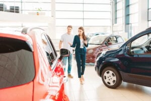 A man buying a car in Spain in a showroom with a salesperson