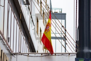 A Spanish flag on a bridge