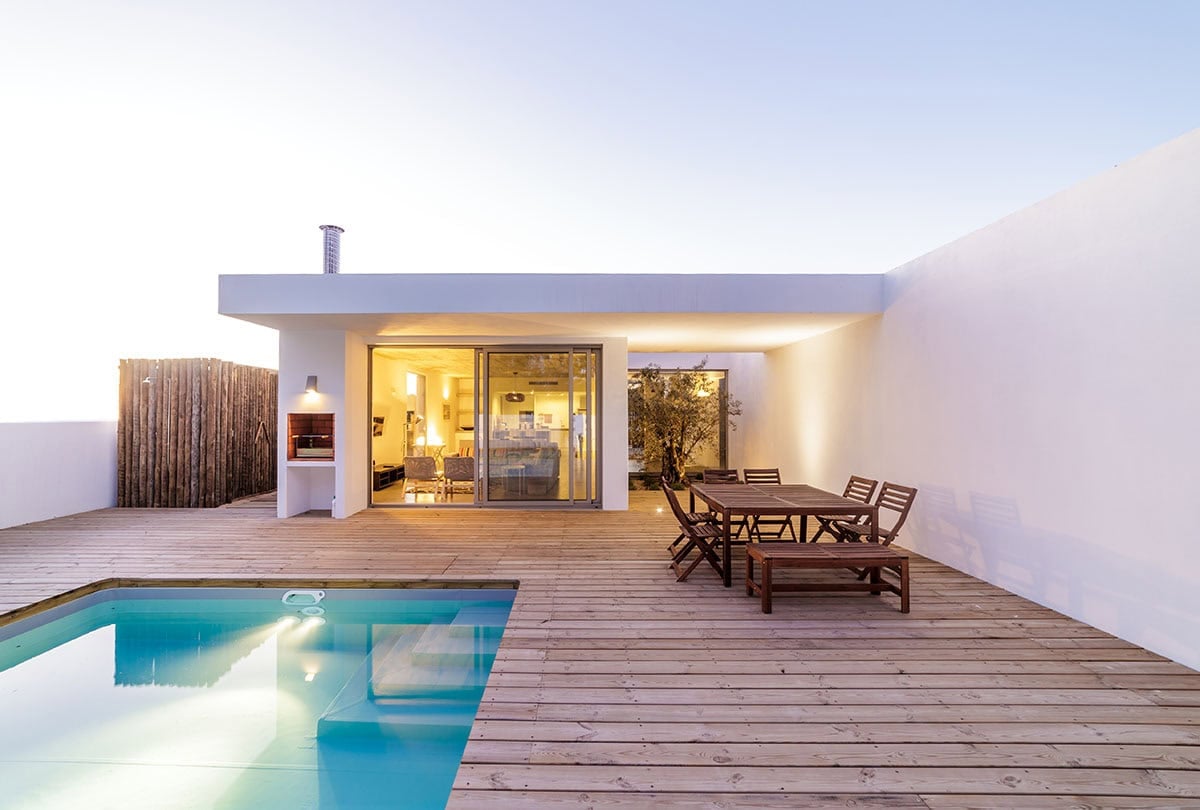 modern house with garden swimming pool and wooden deck