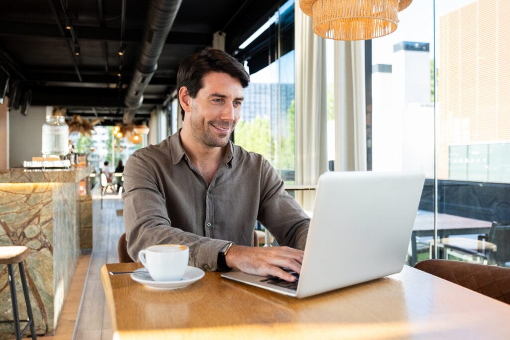 A remote worker in a cafe who has his DNV renewal coming up.